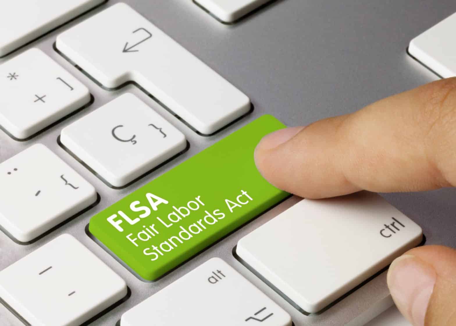Keyboard with a green button that says FLSA Fair Labor Standards Act